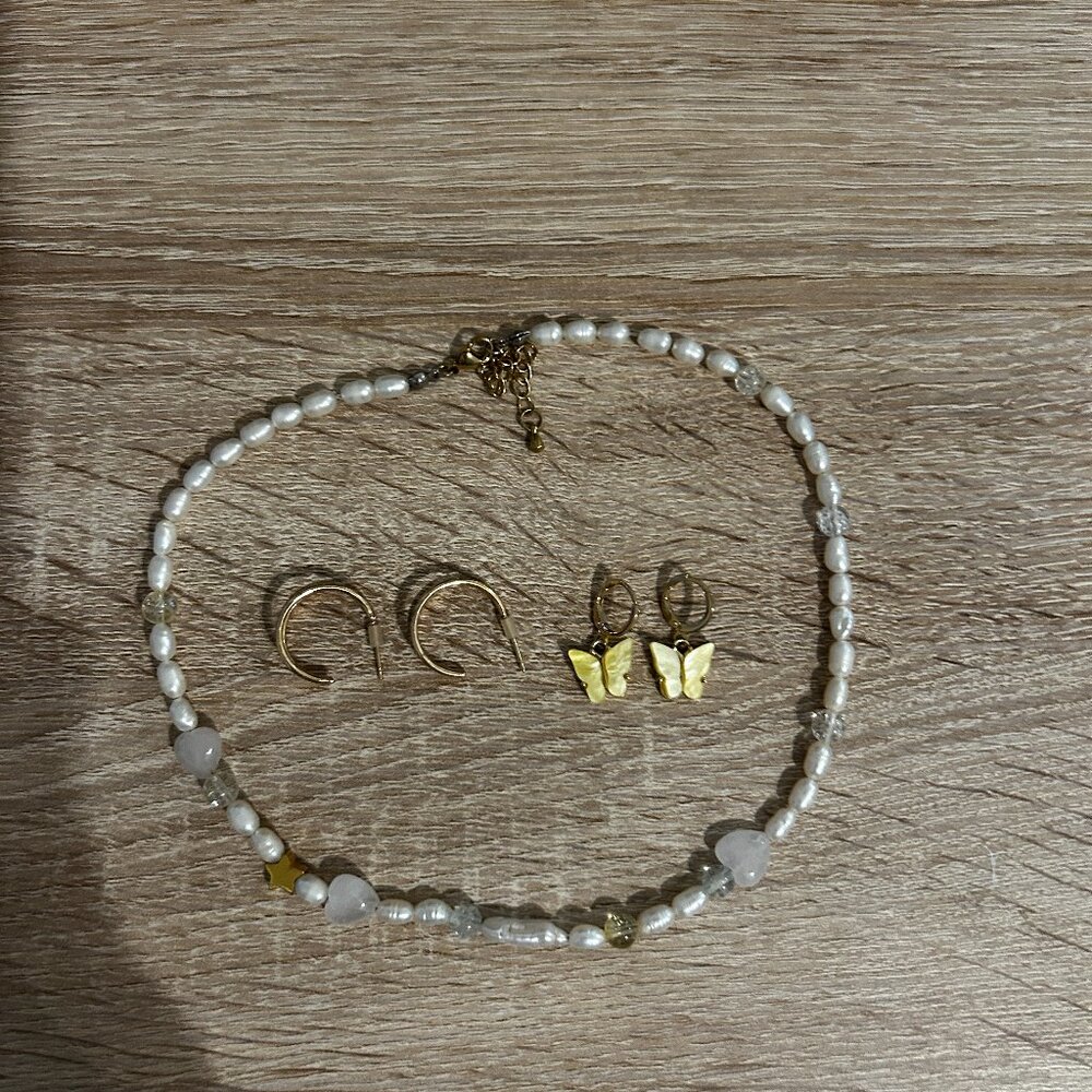 pearl necklace, hoops, butterfly earrings